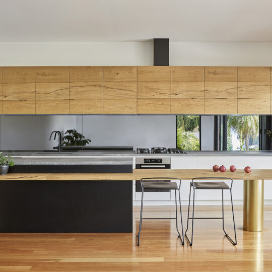 Beautiful Beam Wood Natural Lignapal timber veneer in the kitchen cabinets and island bench of Pomegranate House